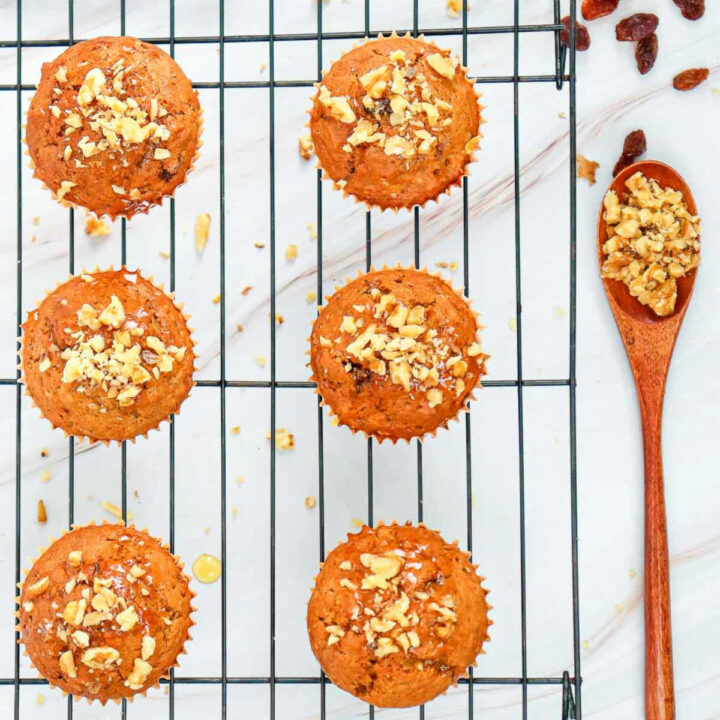 Cool carrot cake muffins on a wire rack.