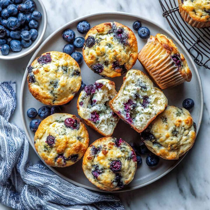 Cottage cheese blurberry muffins on a grey plate.