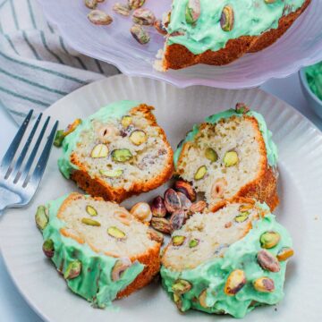 Four slices of pistachio bundt cake placed on a white serving plate.
