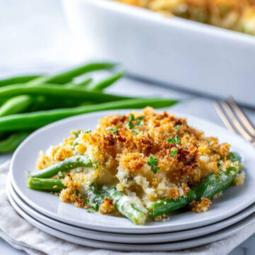 Golden baked green bean casserole with crisp garlic butter crumbs throughout.