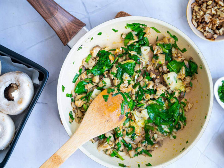 Sauted veggies in a frying pan.