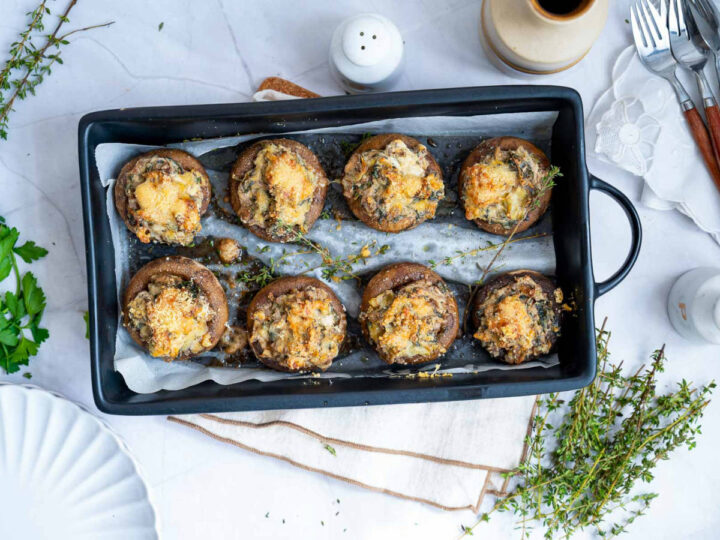 Stuffed mushrooms baked in a tray.