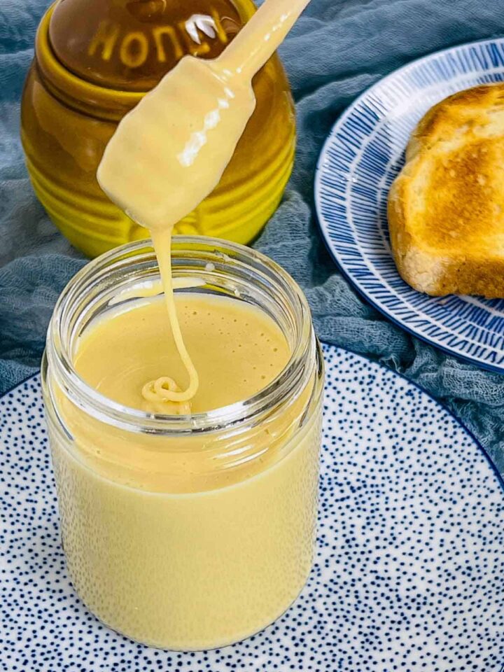 It's a honey product with a creamy, opaque, and spreadable texture, unlike the liquid or clear texture of typical raw honey. It's often used as a spread on toast, pancakes, or biscuits.