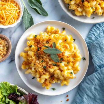 Close-up plated pumpkin sage mac and cheese with sage and breadcrumbs.