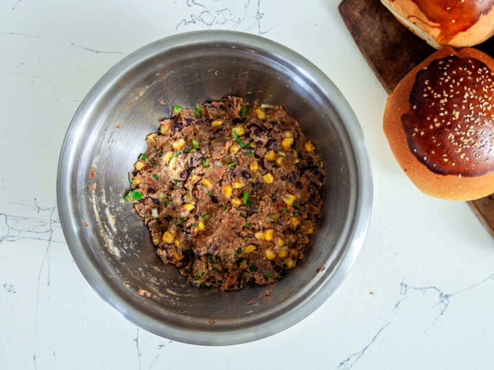 Overhead view of a metal bowl with fully mixed black bean veggie burger mixture ready to be shaped.