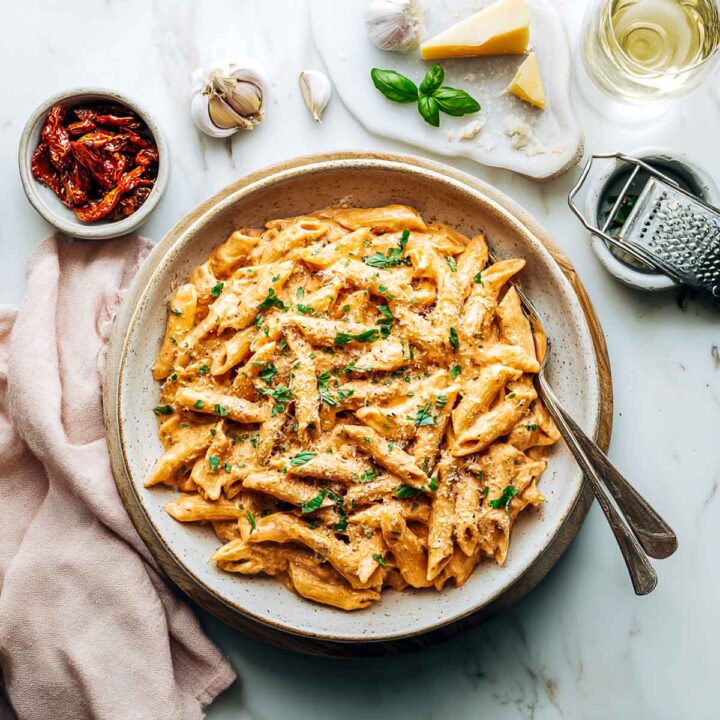 Top view of Marry me pasta bowl placed on a white marble surface.