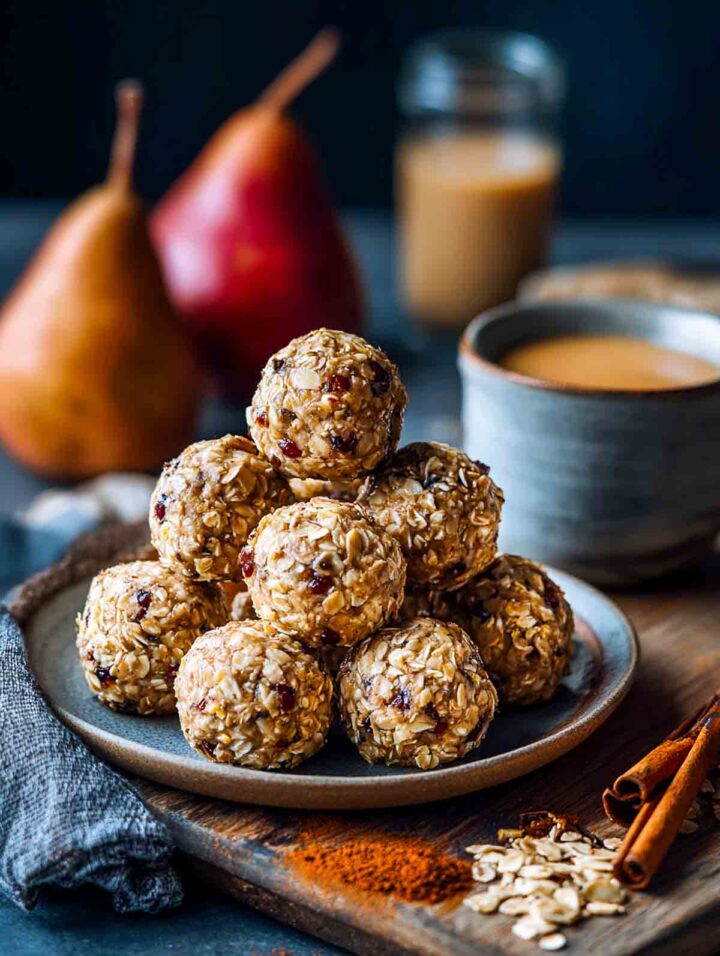 Pear ginger overnight oats bites stacked on a plate.