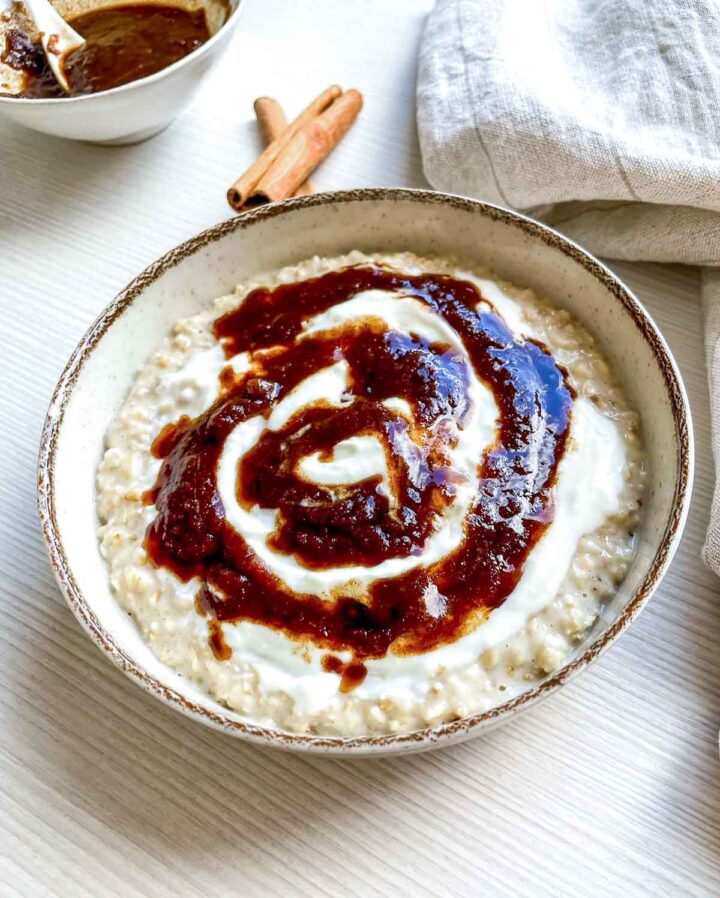 Close-up of cinnamon roll oatmeal with rich cinnamon swirl.