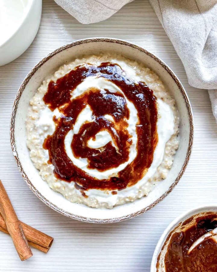 Divide oatmeal into bowls. Top each with a spoonful of the cinnamon mixture and swirl in the cream cheese mixture. Serve immediately.