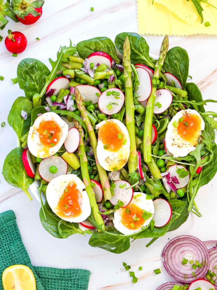 Asparagus and Pea Salad with Soft-Boiled Eggs placed in a wide serving bowl.