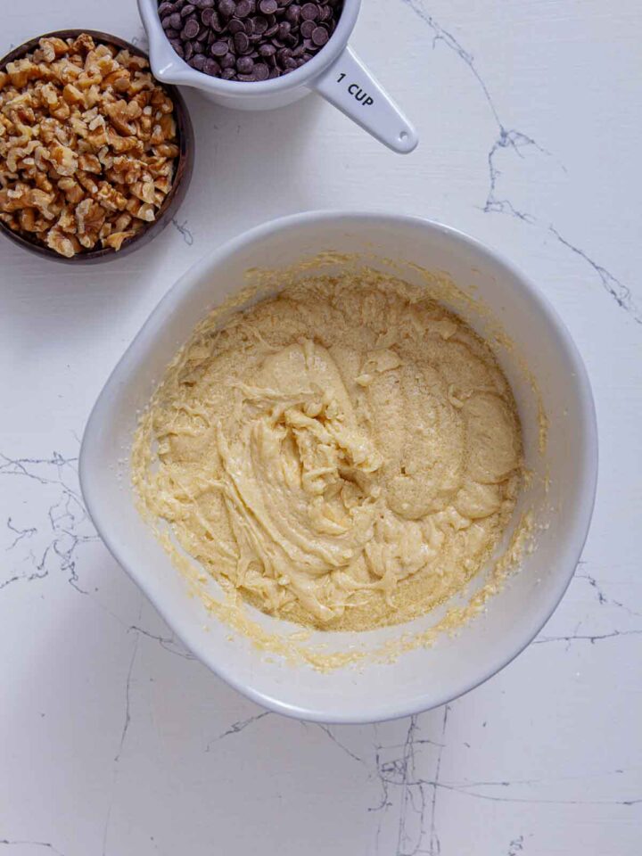 Butter and sugar creamed together in a mixing bowl for brownie batter.