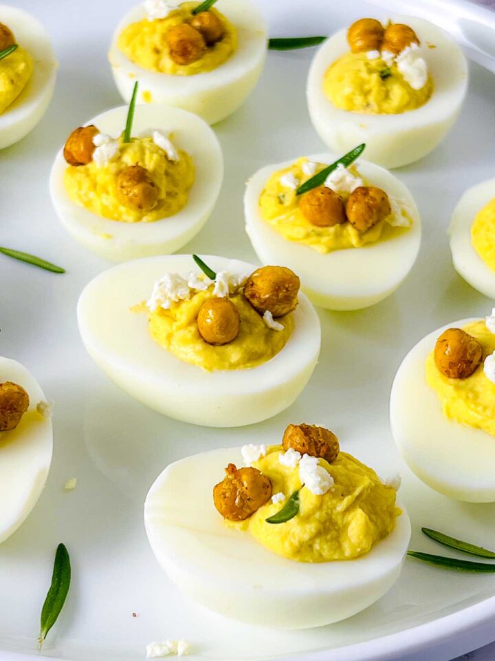 Close up of deviled eggs topped with crispy chickpeas.