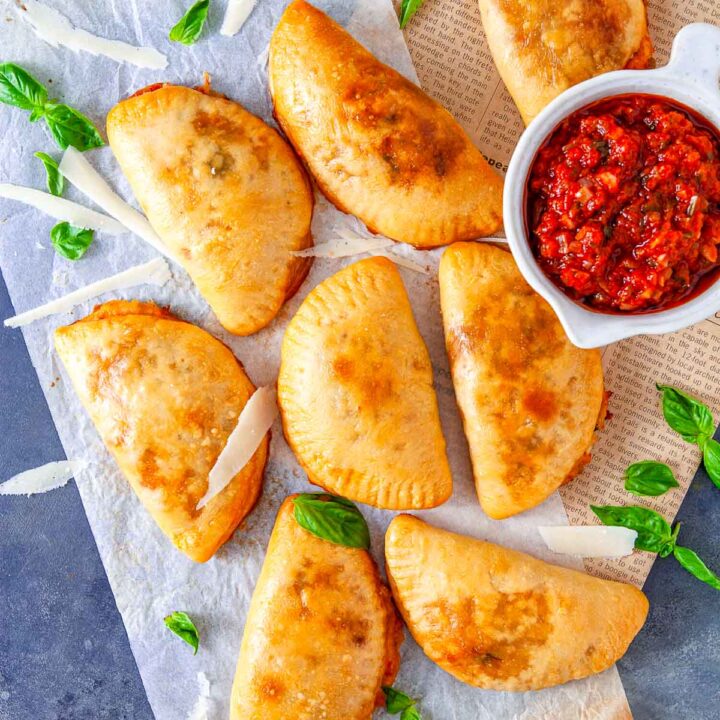Golden baked sausage-stuffed pizza pockets served with marinara dipping sauce.