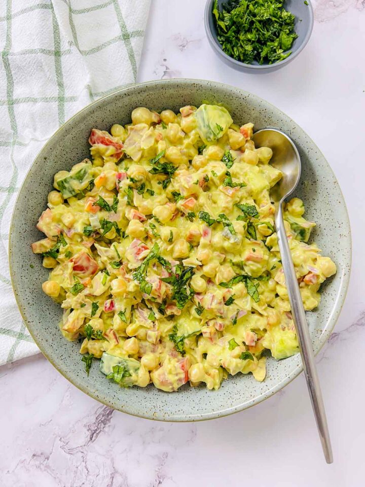 A bowl of tuna chickpea salad made with creamy avocado dressing.