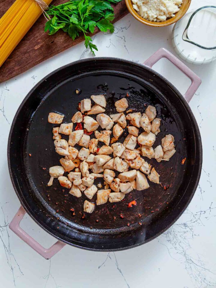Chicken is sautéed until lightly golden to build flavor, spread evenly for a proper sear.