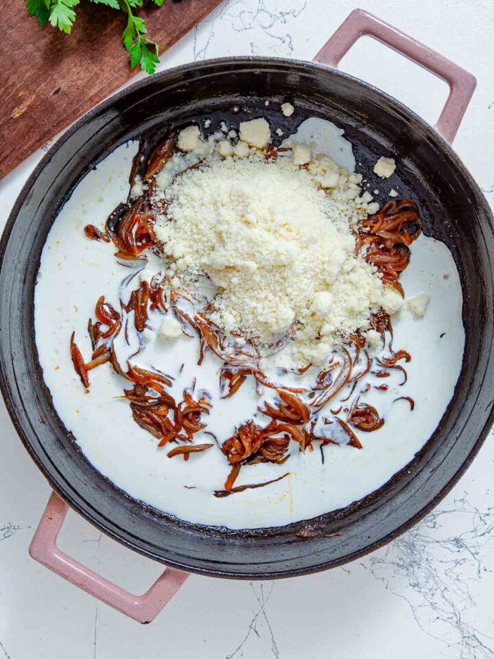 Cream and cheese are added to the caramelized onions to create a rich, creamy sauce.