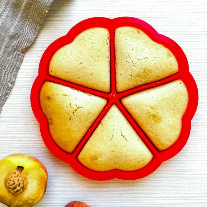 Baked waffles in a red segmented mold with golden edges