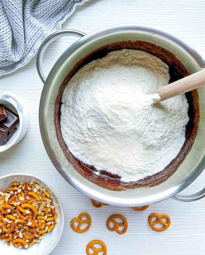 Flour added to chocolate mixture in saucepan