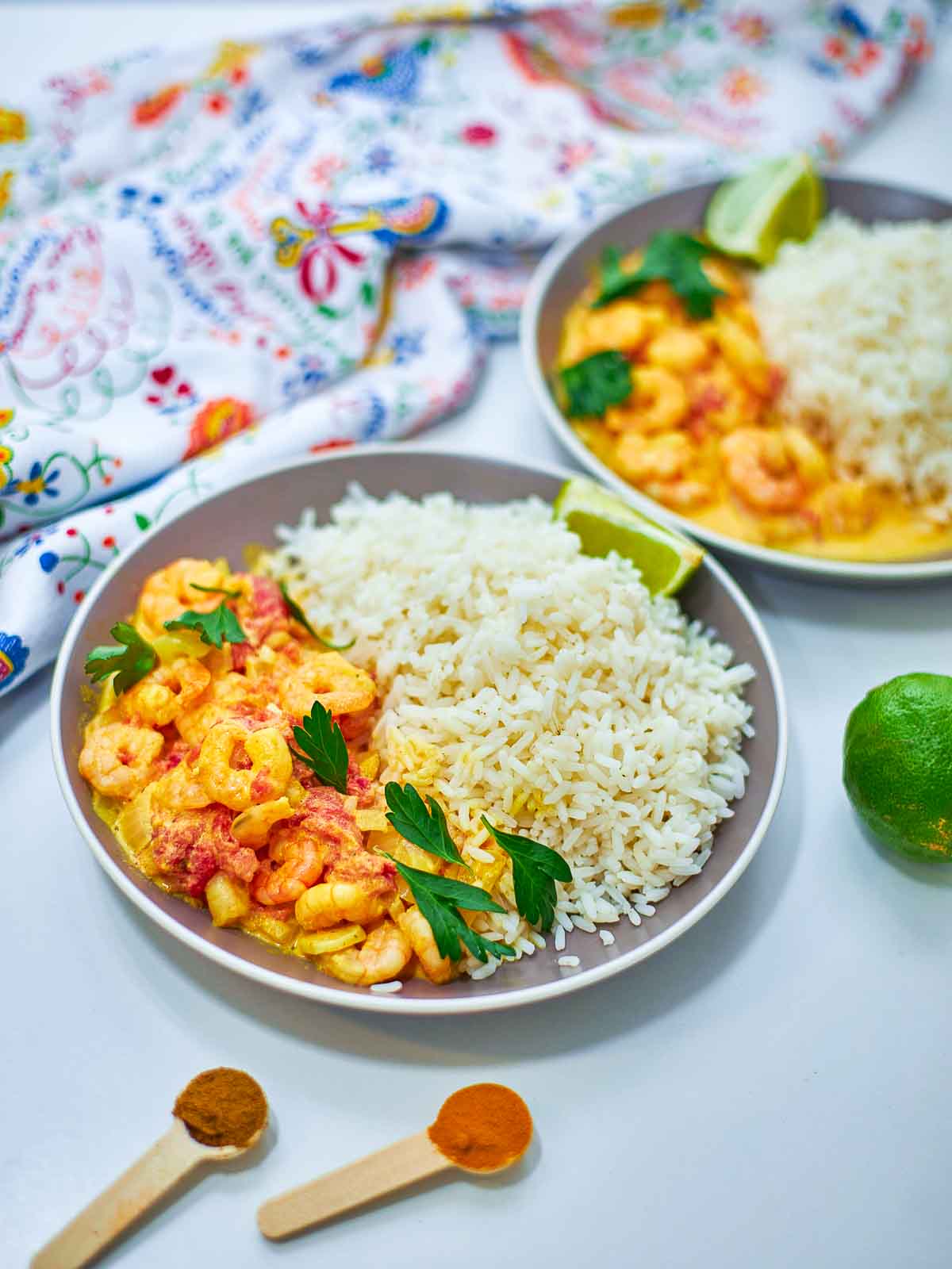 A creamy, flavorful shrimp dish served with fluffy rice, finished with fresh herbs and a squeeze of lime for a vibrant, comforting meal.