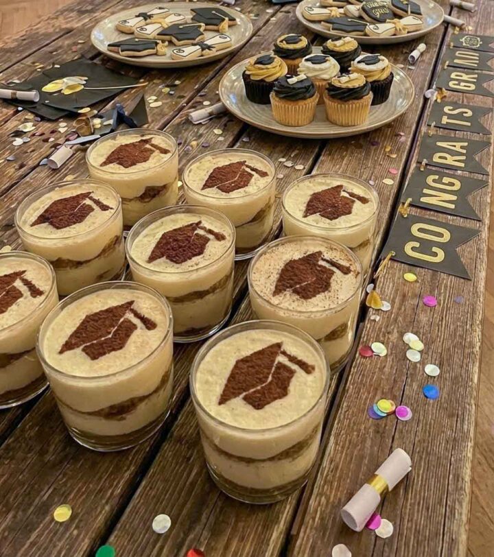 Tiramisu cups decorated with a graduation cap style stencil.