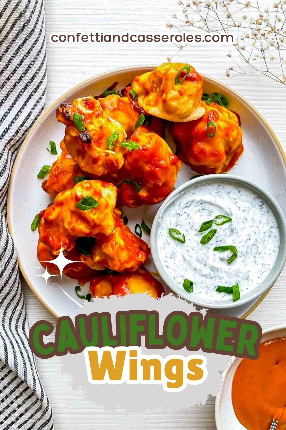 Buffalo cauliflower wings topped with green onions and served with a creamy dipping sauce.