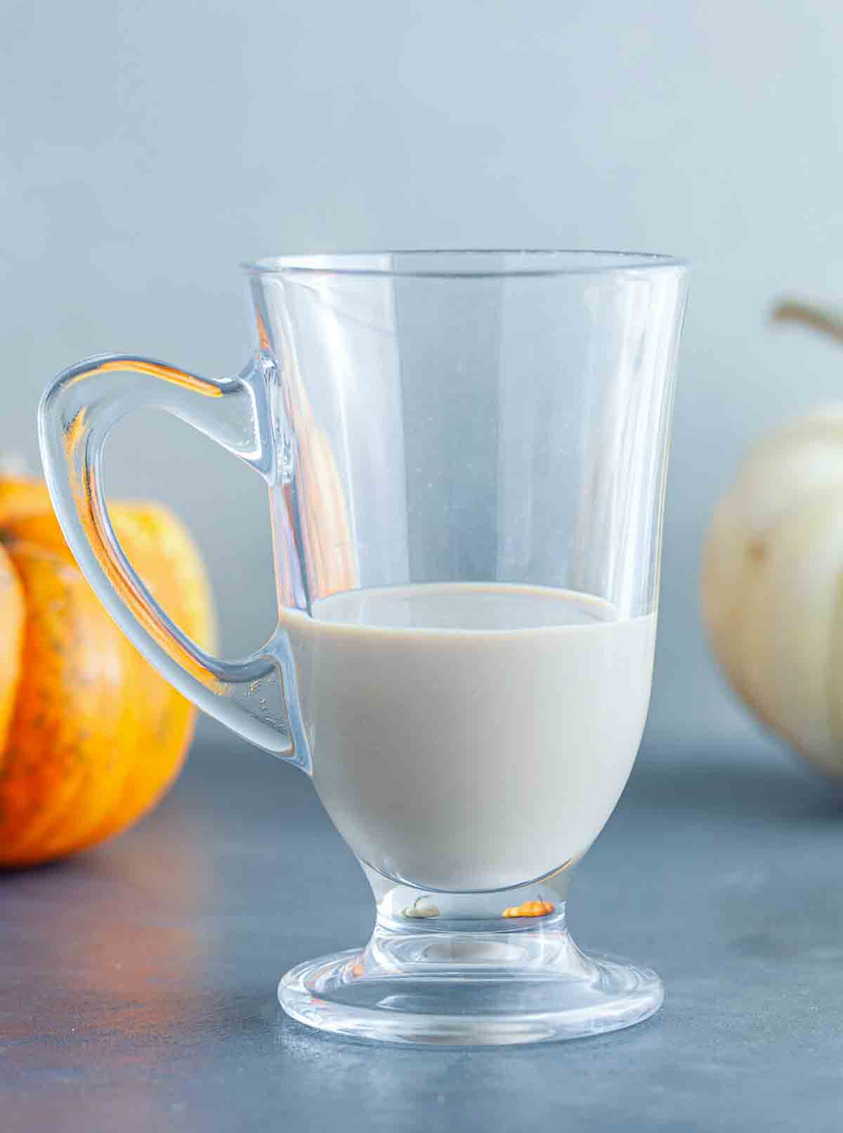 Brew the spiced grounds as usual.
A footed glass mug filled about a third of the way with creamy Irish cream liqueur.